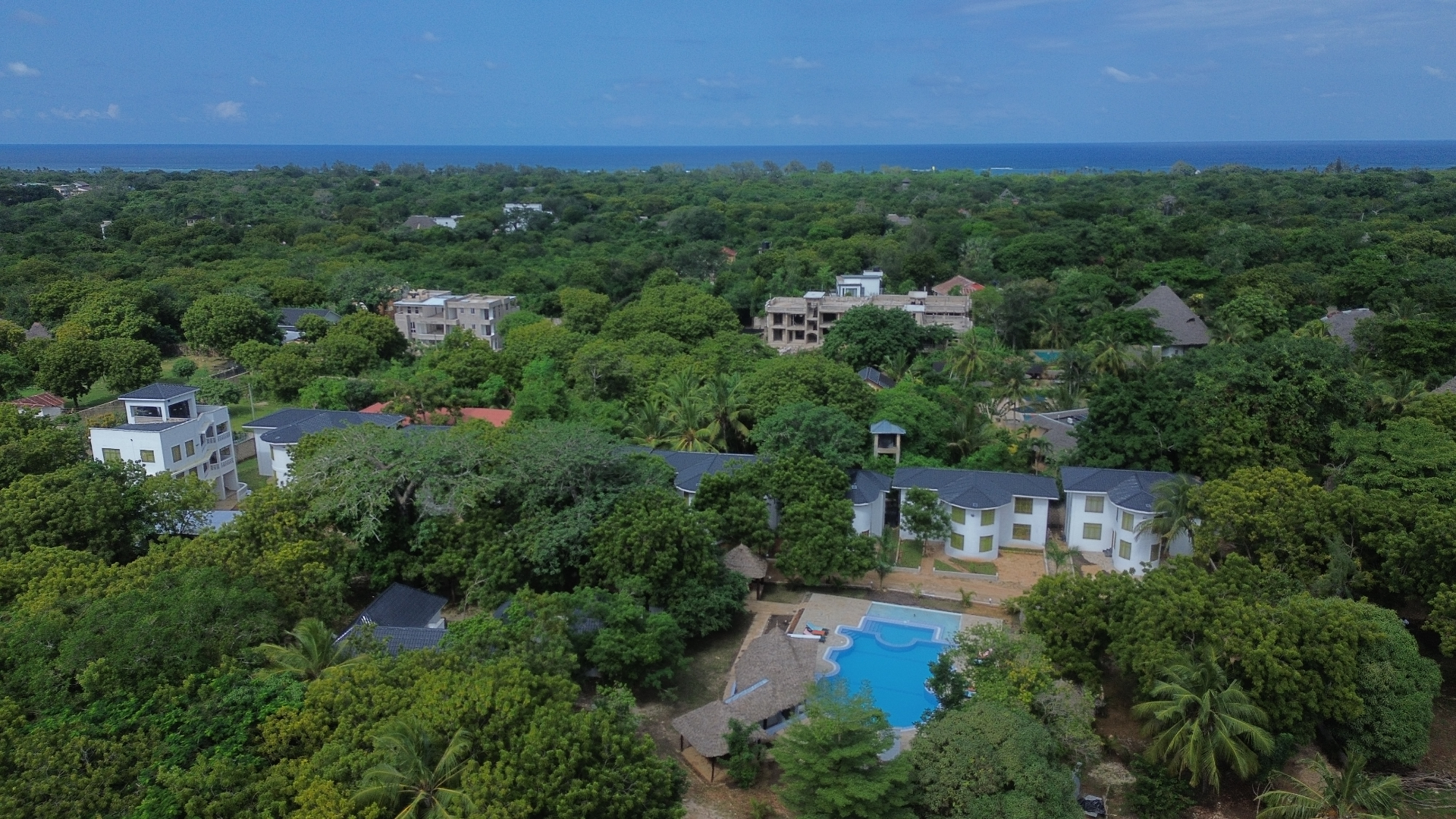 Aerial view of Musituni Luxury Villas with pool and ocean beyond